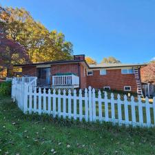 Residence-Roofing-Restoration-Transforms-Home-with-Dark-Bronze-Gutters-and-Gutter-Guards-in-Erwin-TN 0